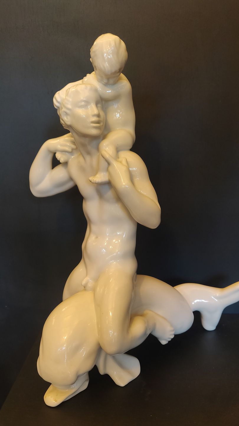 Kai Nielsen Man with boy on shoulders on dolphin. 42cm. 1 black.